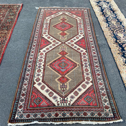 brown red and teal rug 5' x 10'9"