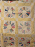 Yellow vintage quilt with flower pattern 67" x 85"