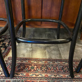set of 4 black bar stools with woven seats