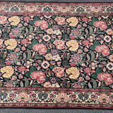 Floral rug with black field  4'6" x 7'5"