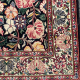 Floral rug with black field  4'6" x 7'5"