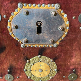trunk embellished with Spanish coins
