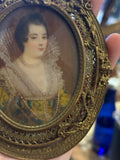 Handpainted femaile portrait in oval filigree frame
