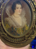 Handpainted femaile portrait in oval filigree frame