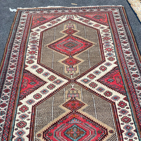 brown red and teal rug 5' x 10'9"