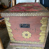 trunk embellished with Spanish coins