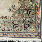 ivory rug with sage border and center medallion  4'7" x 6'7"