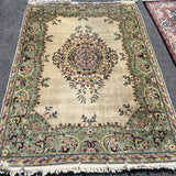 ivory rug with sage border and center medallion  4'7" x 6'7"