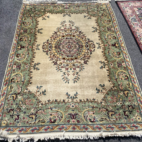 ivory rug with sage border and center medallion  4'7" x 6'7"