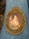 Handpainted femaile portrait in oval filigree frame