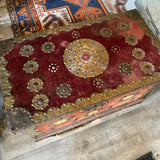 trunk embellished with Spanish coins