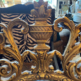 oval shaped ornate gold framed mirror
