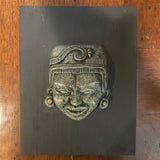 green stone face art