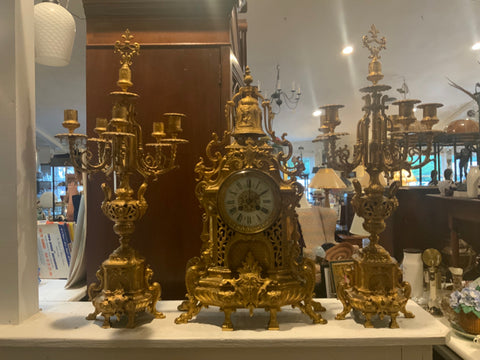 gilded garniture set clock and two candleabras