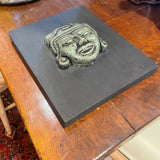 green stone face art
