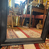 pair of black framed mirrors