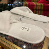 GP white slippers with GPH initials in black
