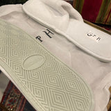 GP white slippers with GPH initials in black