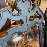 pair of black framed mirrors