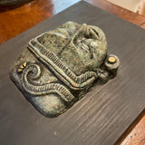 green stone face art