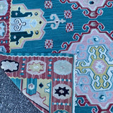 green and red kilim rug