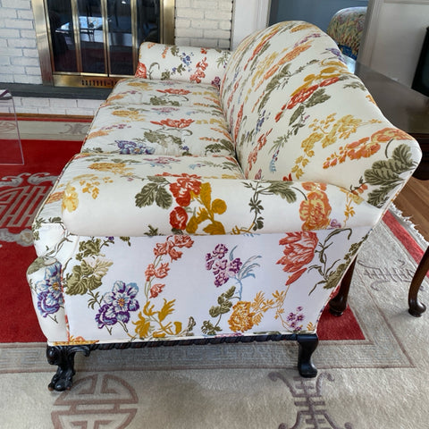 Camel back sofa custom upholstered in silk floral fabric and down cushions