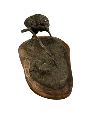 Bronze bird with worm sculpture on wood base signed Lowell Davis
