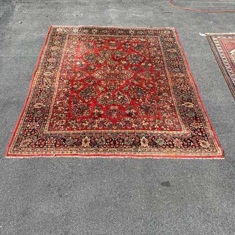 1930's Sarouk floral rug with red field  7'7" x 9'7"