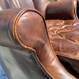 Pair of Restoration Hardware leather tufted highback arm chairs with ottoman