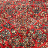 1930's Sarouk floral rug with red field  7'7" x 9'7"