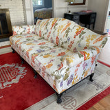 Camel back sofa custom upholstered in silk floral fabric and down cushions