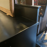 Black bowfront sideboard with three drawers and two side curved doors