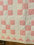 pink and white quilt