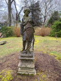 Concrete statue of classical lady on plinth