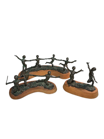 Nine Bronze Dancers By Sue Eisenberg
