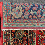 1930's Sarouk floral rug with red field  7'7" x 9'7"