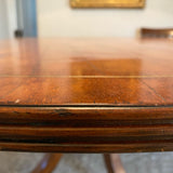 Beautiful Regency style round wood pedestal table with brass detail