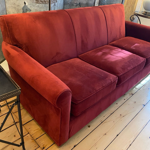 red upholstered Crate and Barrel sofa