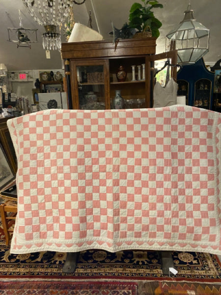 pink and white quilt