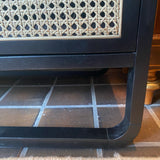 Crate and Barrel black caned chest of 3 drawers and 1 door