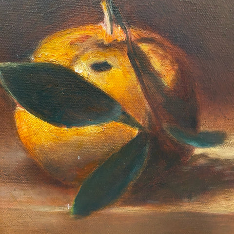 Painting of an orange in gold frame