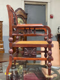 Carved caned open arm chair