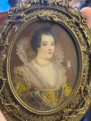 Handpainted femaile portrait in oval filigree frame