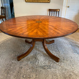 Beautiful Regency style round wood pedestal table with brass detail