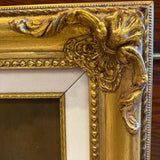 Painting of an orange in gold frame