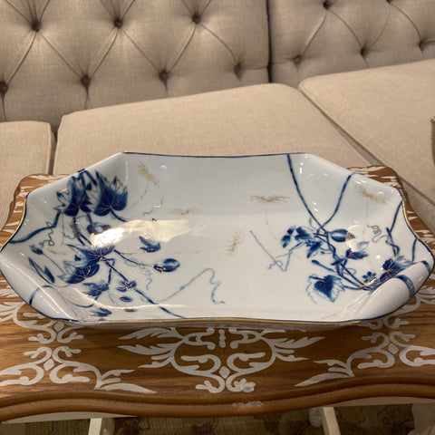 blue and white serving dish with gold accent