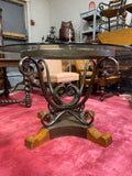 scrolled iron based glass top table