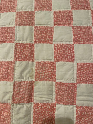 pink and white quilt