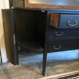 Black bowfront sideboard with three drawers and two side curved doors