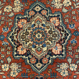 small red rug with center medallion
